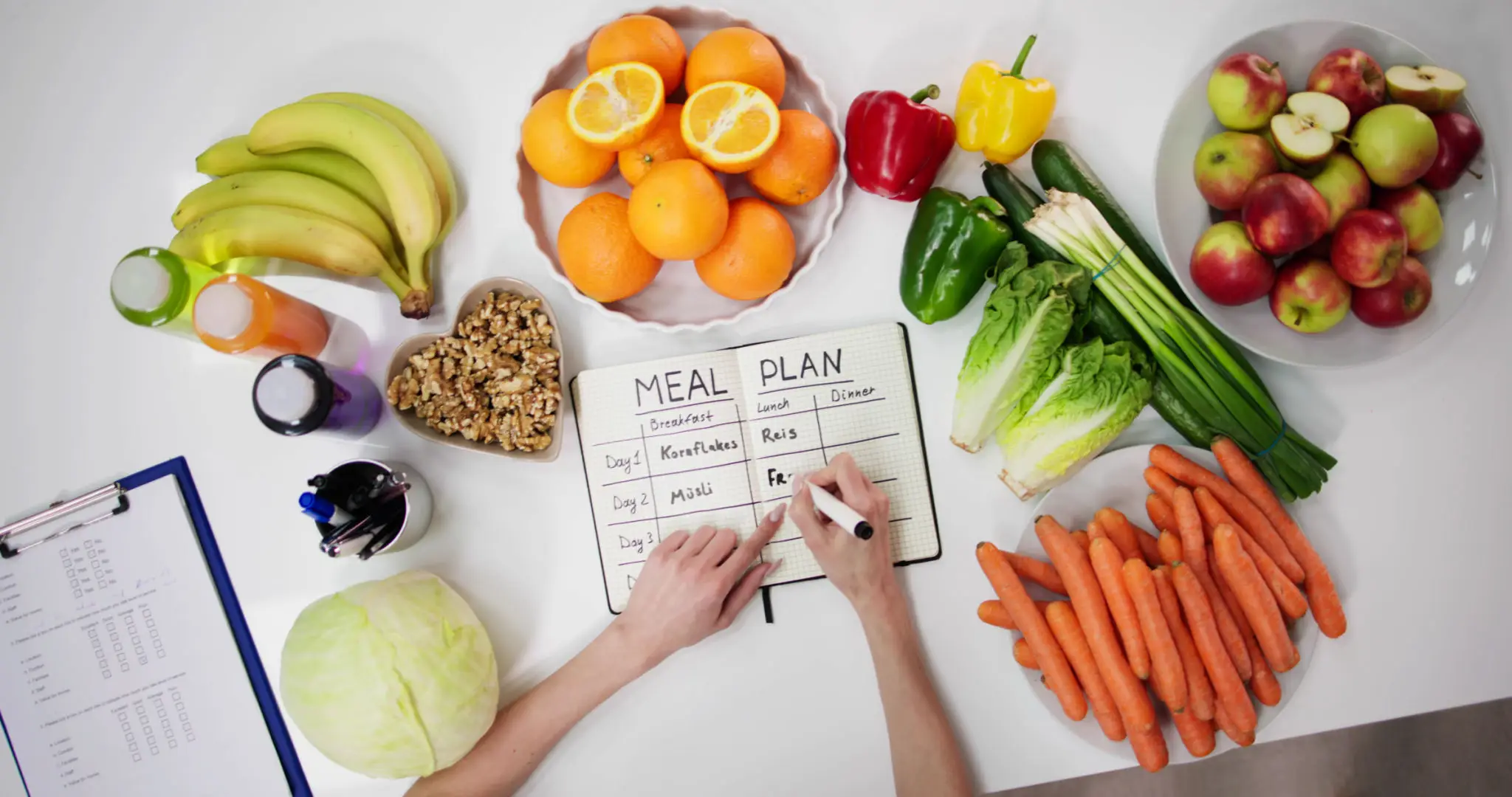 A person writing on the meal plan