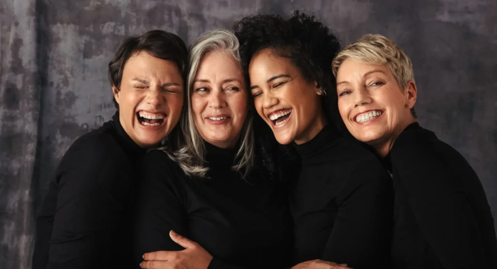 A group of women smiling for the camera.