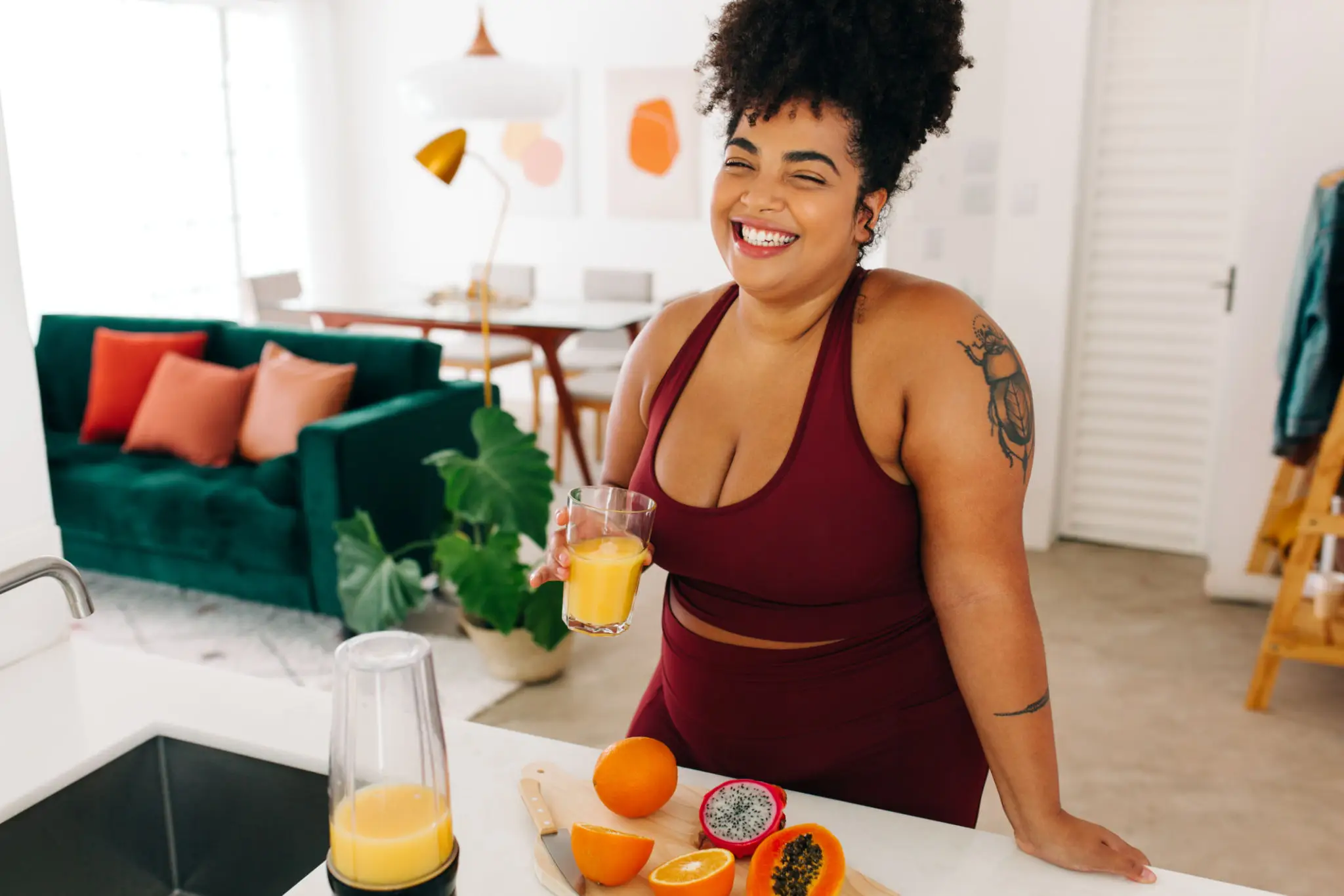 A woman sitting at a table with some food.